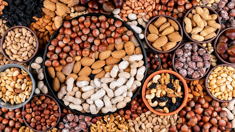 An assortment of nuts and seeds, highlighting vitamin E-rich foods that support healthy eyes.