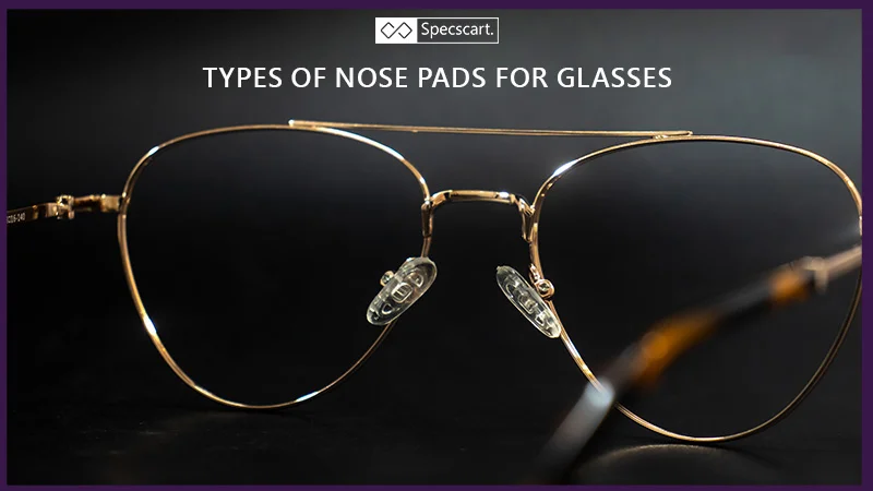 A close-up of a pair of gold-framed pilot glasses highlights the clear, oval-shaped nose pads resting on the bridge. The image is set against a dark background.