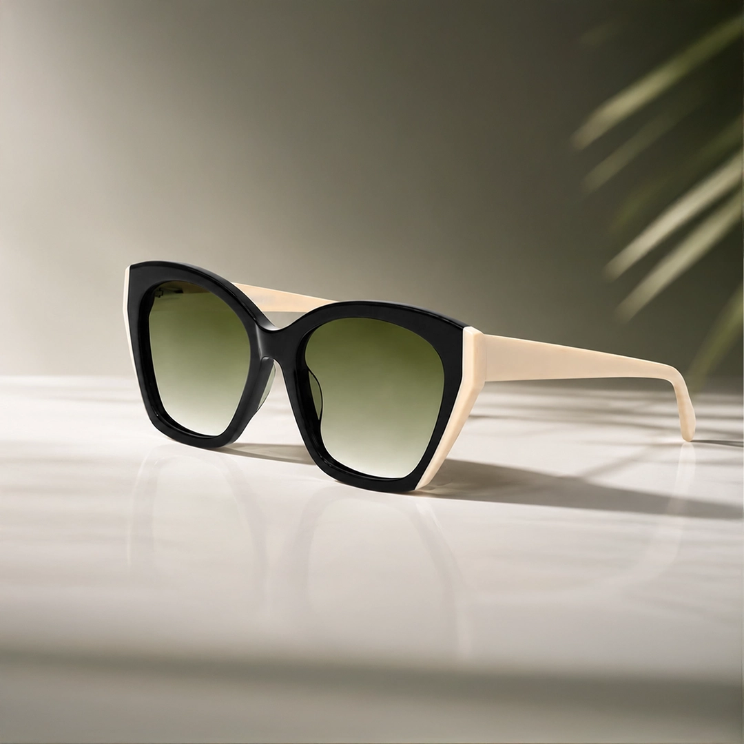Cat Eye Sunglasses A smiling woman wearing sharp black cat-eye sunglasses, an olive bikini, and a white beach cover-up, holding a summer drink with a yellow straw.