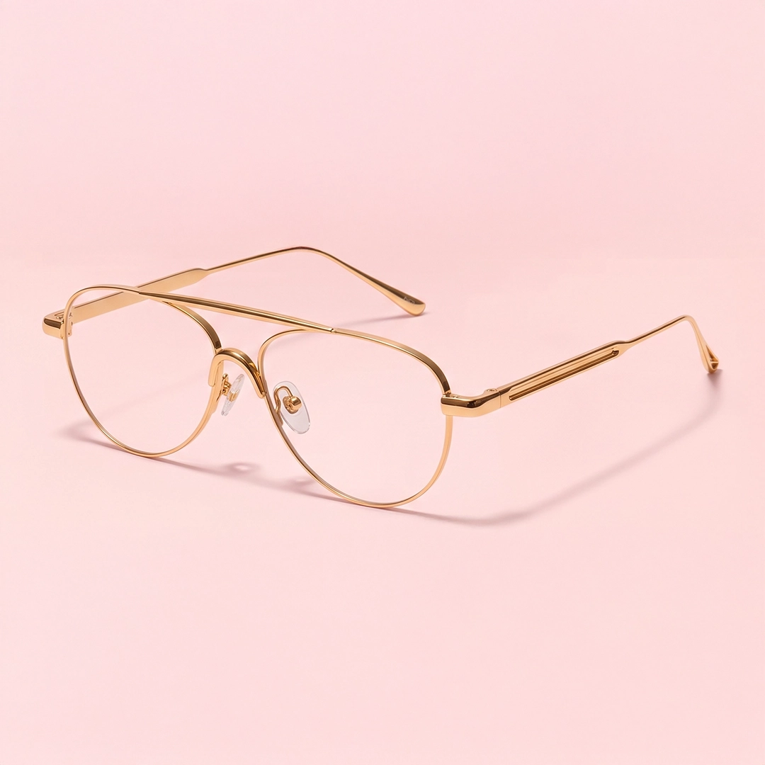 The banner features stylish glasses with gold-coloured metal rectangular frames, featuring intricate edges and tortoiseshell-patterned temple tips, presented on a white pedestal against a light beige background. The left side of the banner showcases promotional text for Gold Glasses and an Excellent Trustpilot rating.