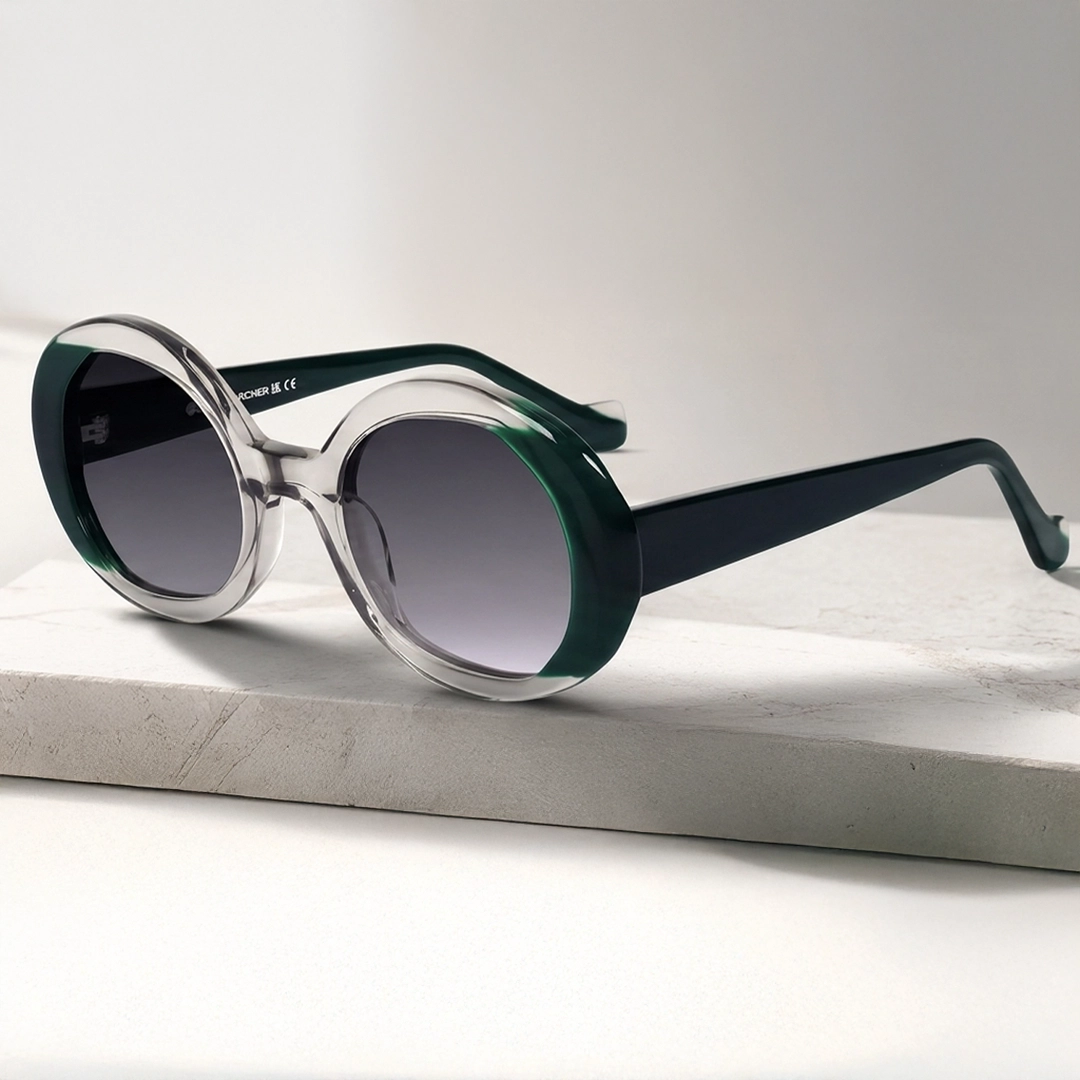 Oversized Sunglasses Model wearing oversized dark sunglasses and a black blazer, looking to the side. The image highlights a bold, fashionable eyewear style.