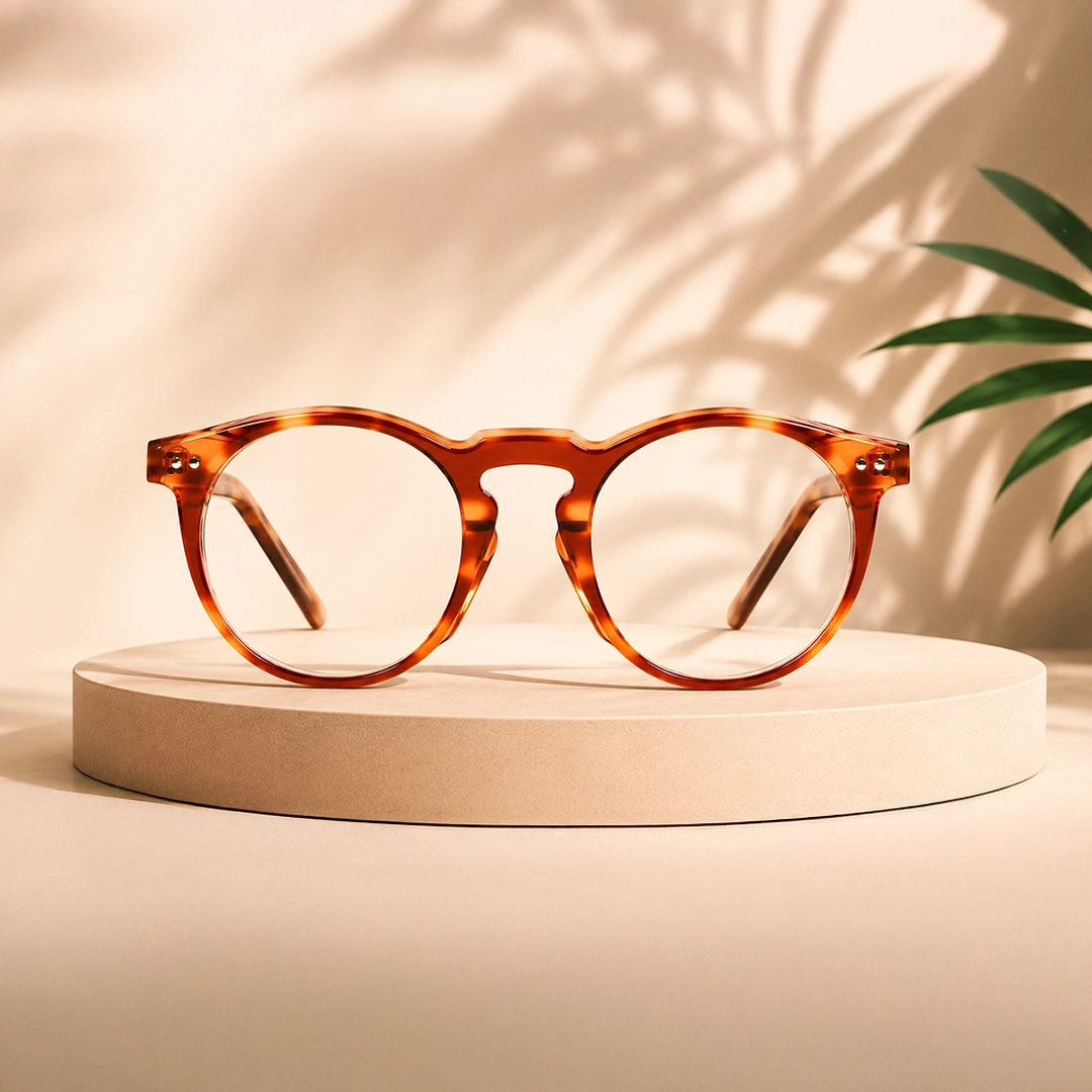 Orange Glasses Translucent orange square glasses with a subtle reflection on a soft peach background.