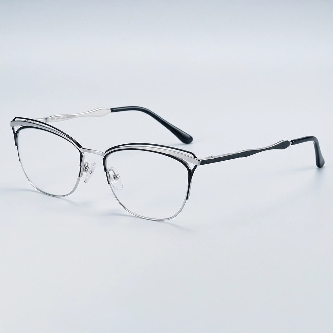 Silver Glasses Silver metal oval glasses with black temple tips displayed on minimalist mint green pedestals.