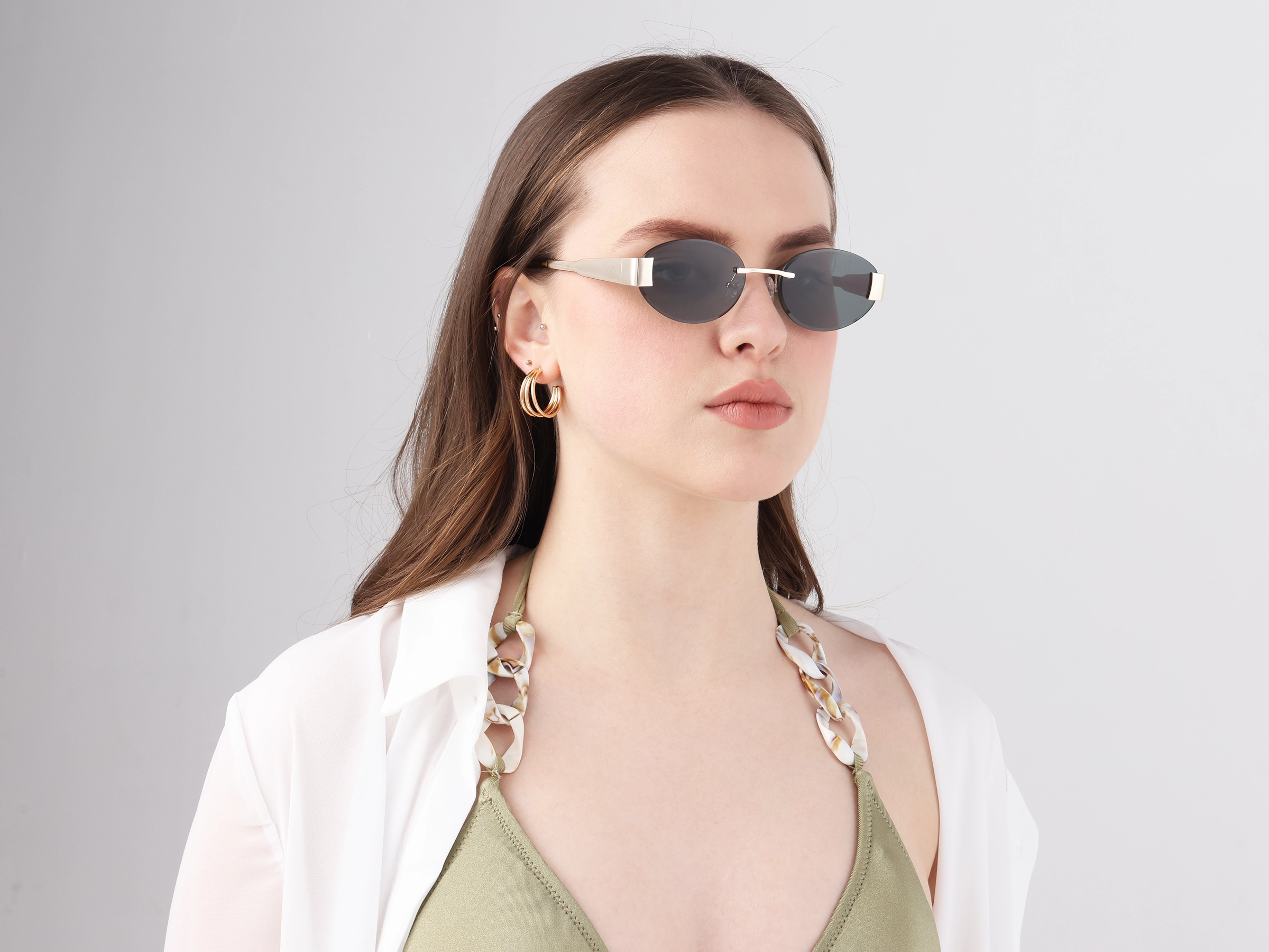 Oval Rimless Sunglasses With Green Tin