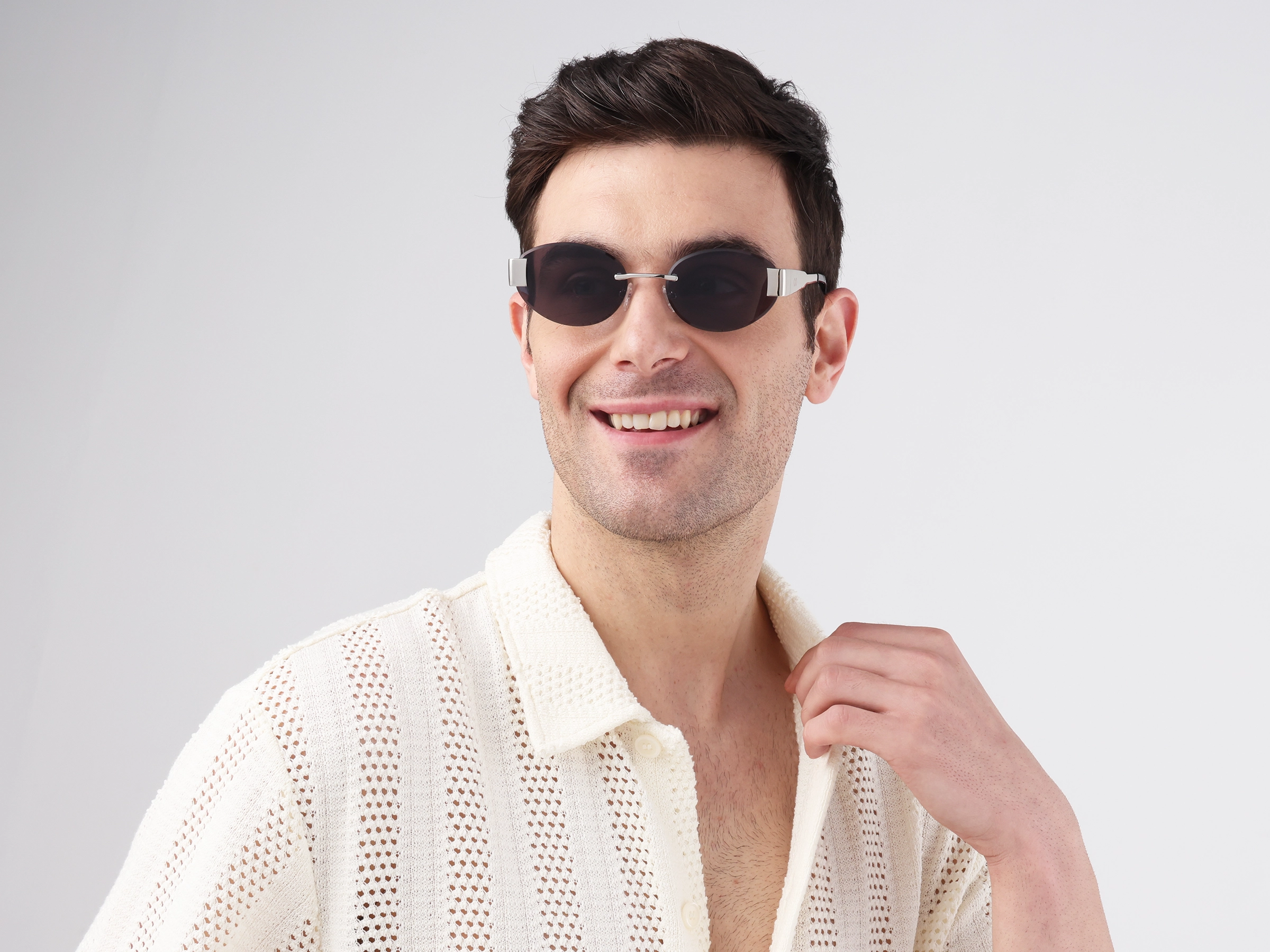 Oval Silver Rimless Sunglasses With Blue Tint