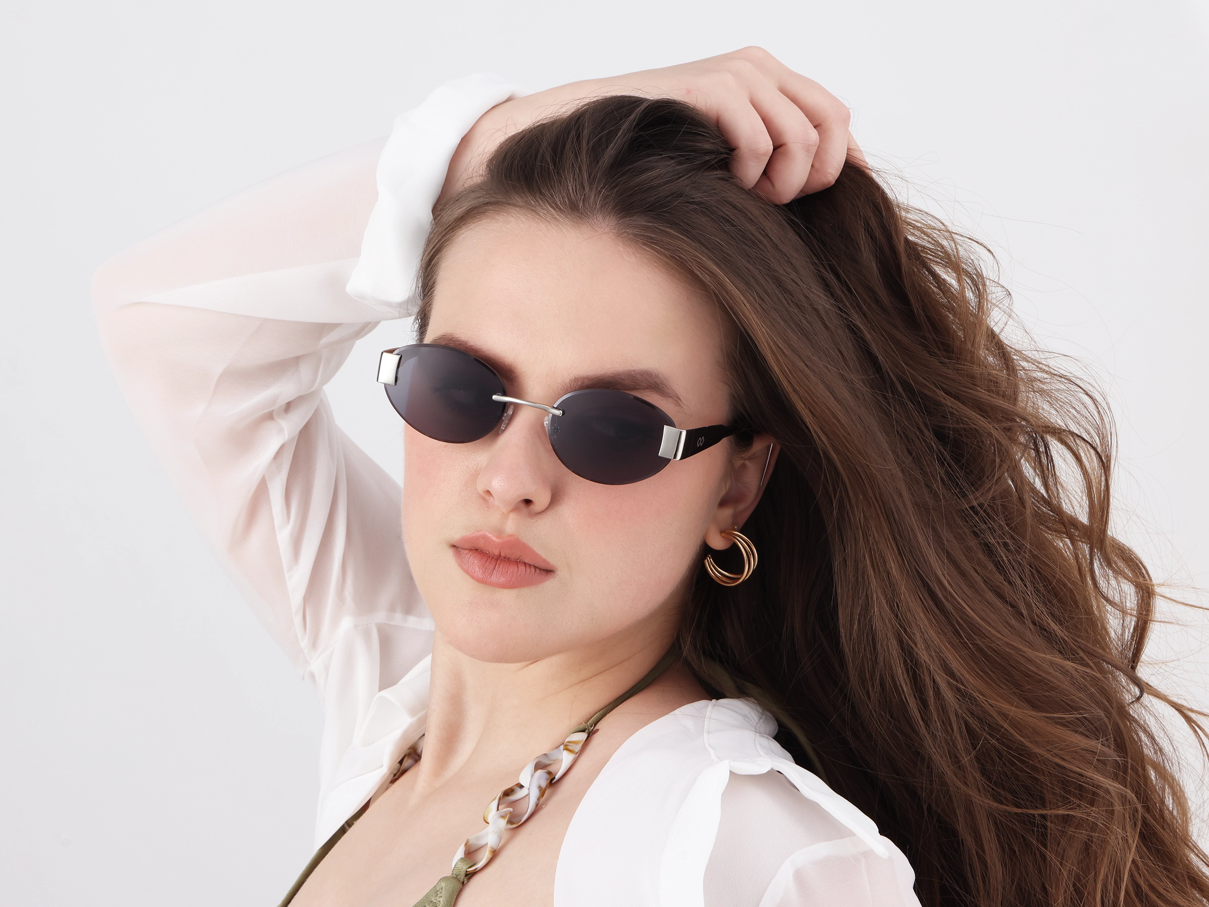 Oval Silver Rimless Sunglasses With Blue Tint