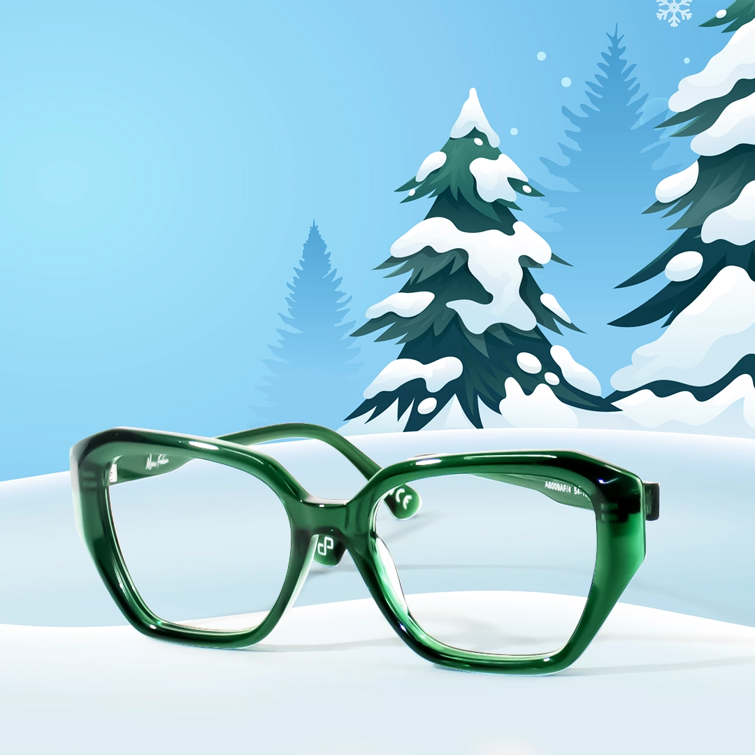 Festive winter banner with a snowman in a Santa hat and a pair of large, emerald green Specscart glasses lying in the snow.