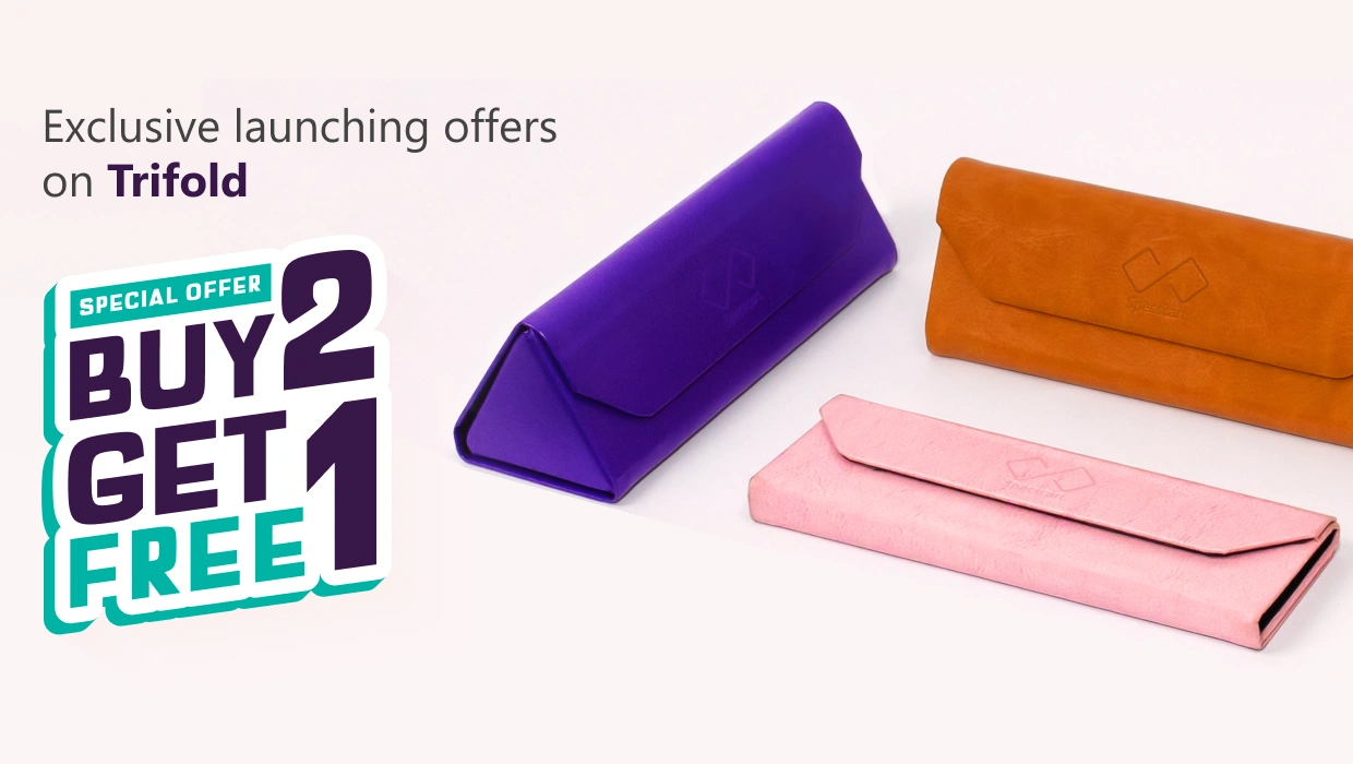 Banner advertising ‘Exclusive Launching Offer On Trifold, Buy 2 Get 1 Free’ featuring three pastel-coloured Specscart trifold cases in pink, purple, and brown, arranged in pairs on a pale background.