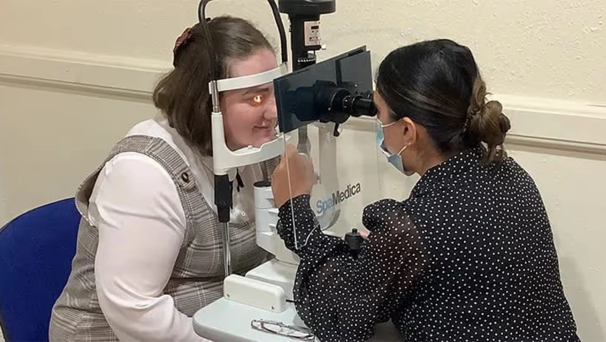 Optician conducting an eye test for a customer in a consultation room. The image promotes Specscart’s free eye test for everyone.