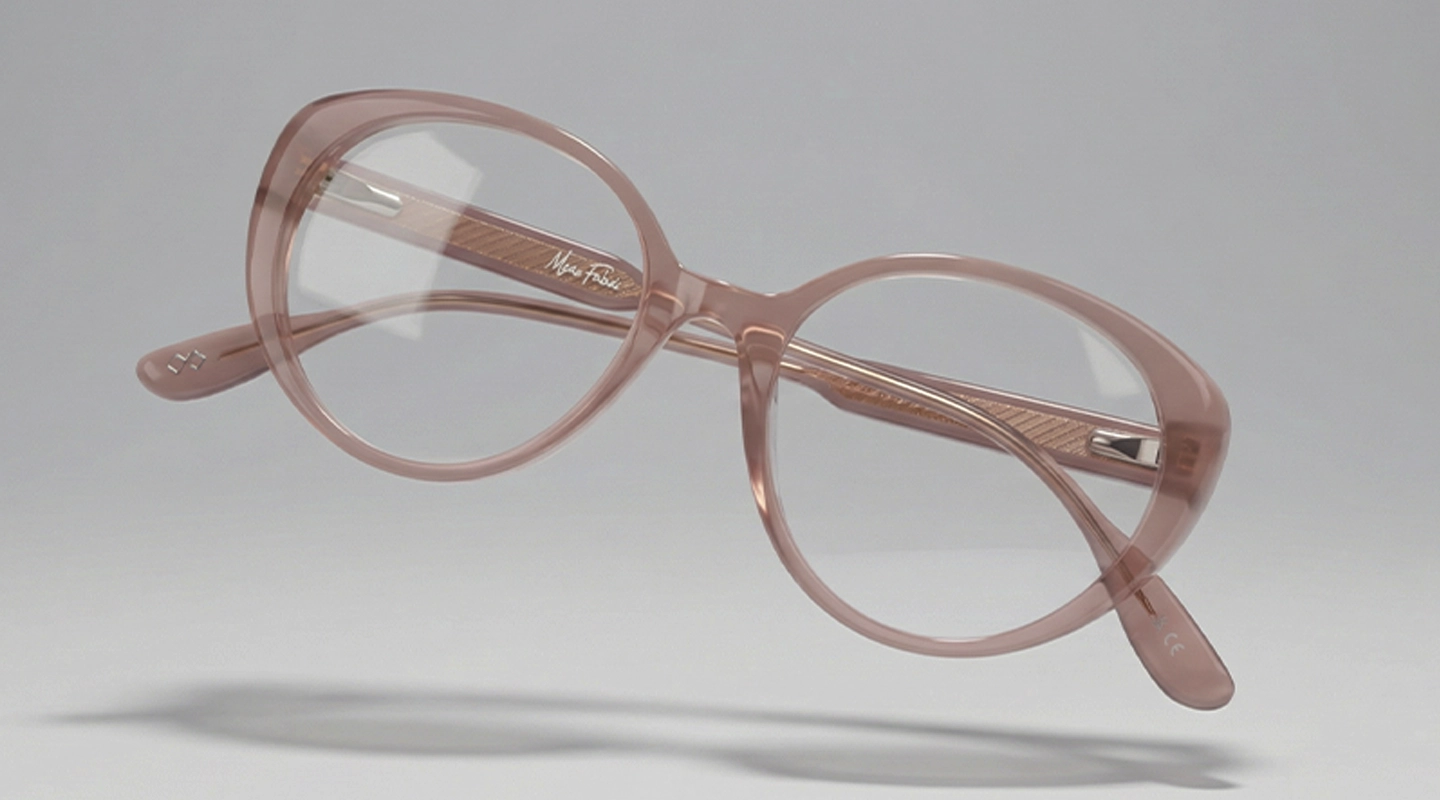 Bold amber-coloured oval eyeglasses with thick round rims, displayed on a clean white background