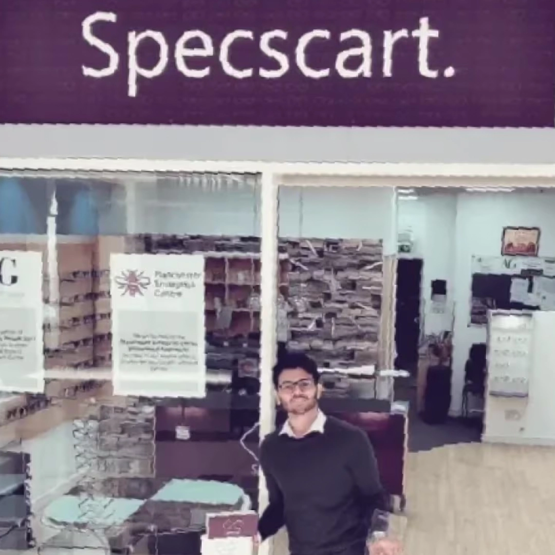 Specscart founder Sid Sethi receiving ‘the Emerging Entrepreneur Award’ from The Business Desk. The background features event signage and branding for the award presentation.