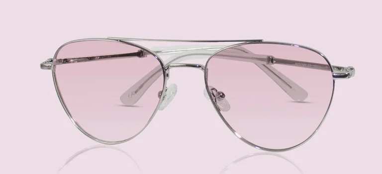 Pink Sunglasses A pair of classic silver-framed pilot sunglasses with soft pink-tinted lenses, displayed against a minimalist pastel pink gradient background.