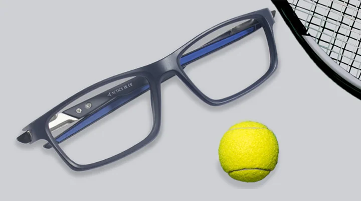 Sports Sunglasses Two pairs of rectangular sports sunglasses with grey and teal lenses, displayed next to a tennis racket and ball with the Actics logo on a white base.