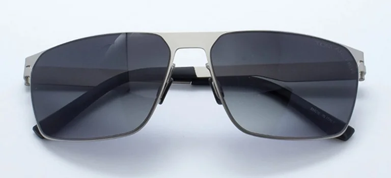 Flat Top Sunglasses Sleek silver metal flat top sunglasses with dark tinted lenses and thin temples, displayed against a minimalist white background for a modern look.